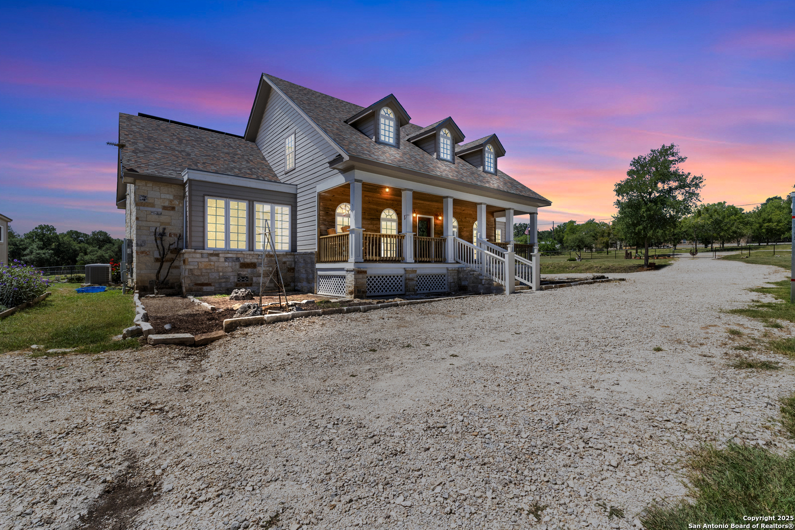 7040 Old Spring Branch Road Spring Branch, TX 78070 - Photo 35 of 43 a view of a house with a yard and sitting area
