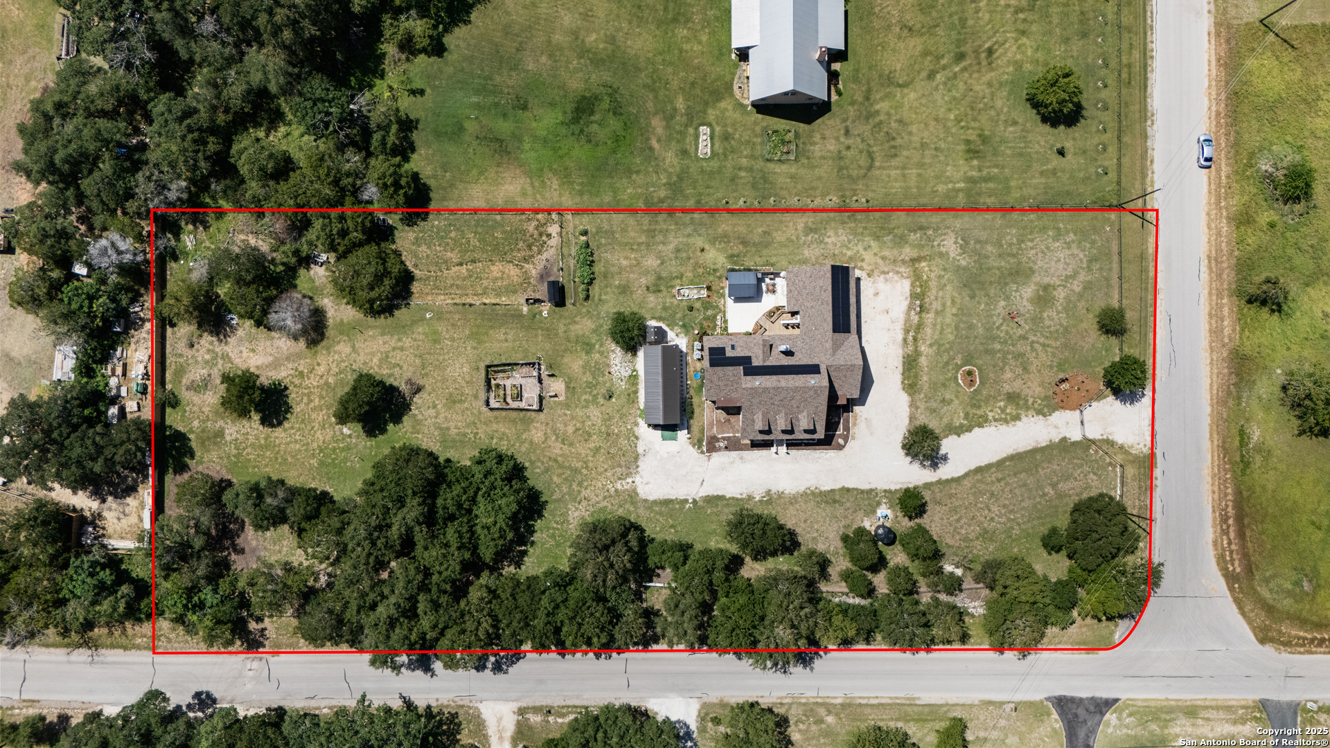 7040 Old Spring Branch Road Spring Branch, TX 78070 - Photo 38 of 43 an aerial view of a house with a yard