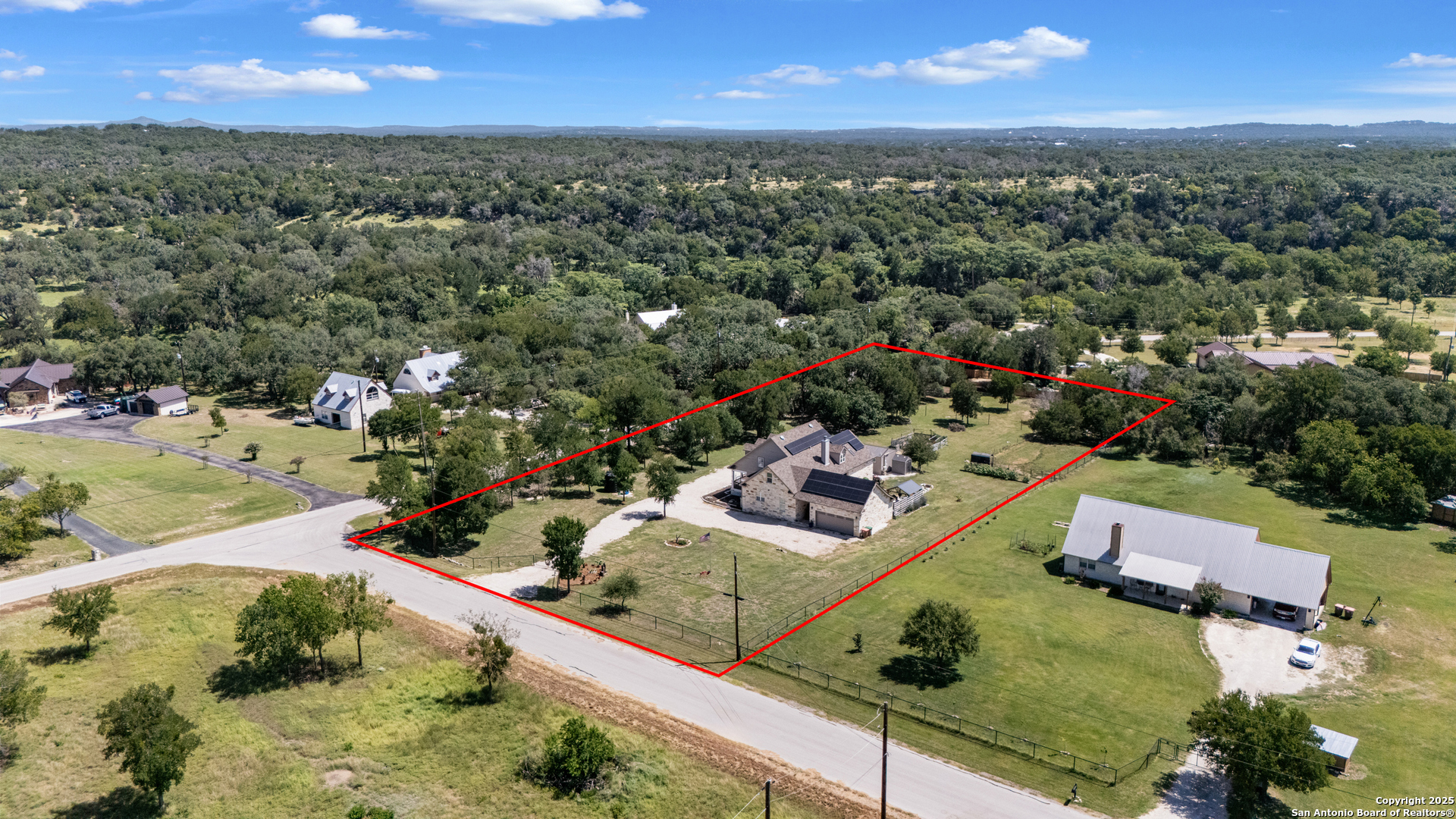 7040 Old Spring Branch Road Spring Branch, TX 78070 - Photo 40 of 43 an aerial view of a residential houses with outdoor space