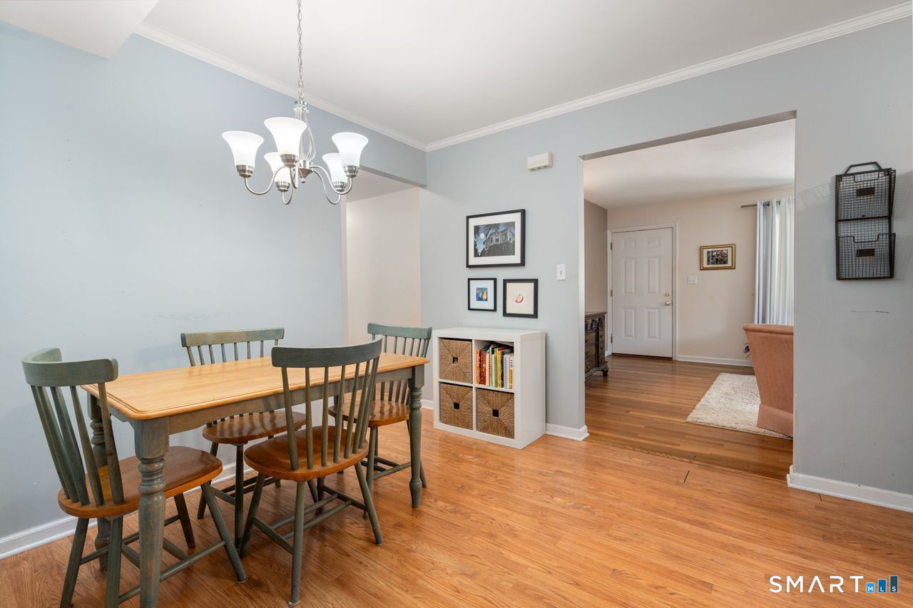 9 Stanton Road North Haven, CT 06473 - Photo 11 of 35 a view of a dining room with furniture and wooden floor