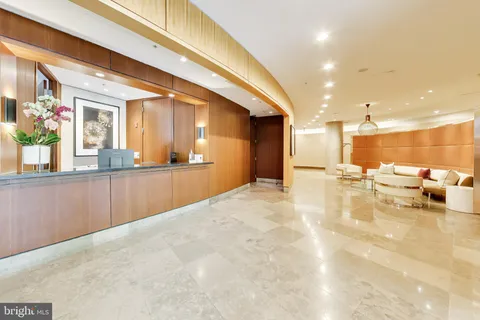 a view of a living room and kitchen