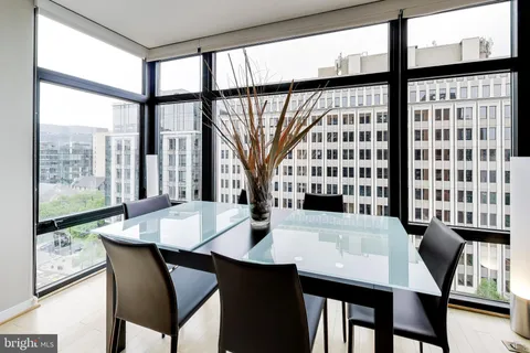 a view of a dining room with furniture and window