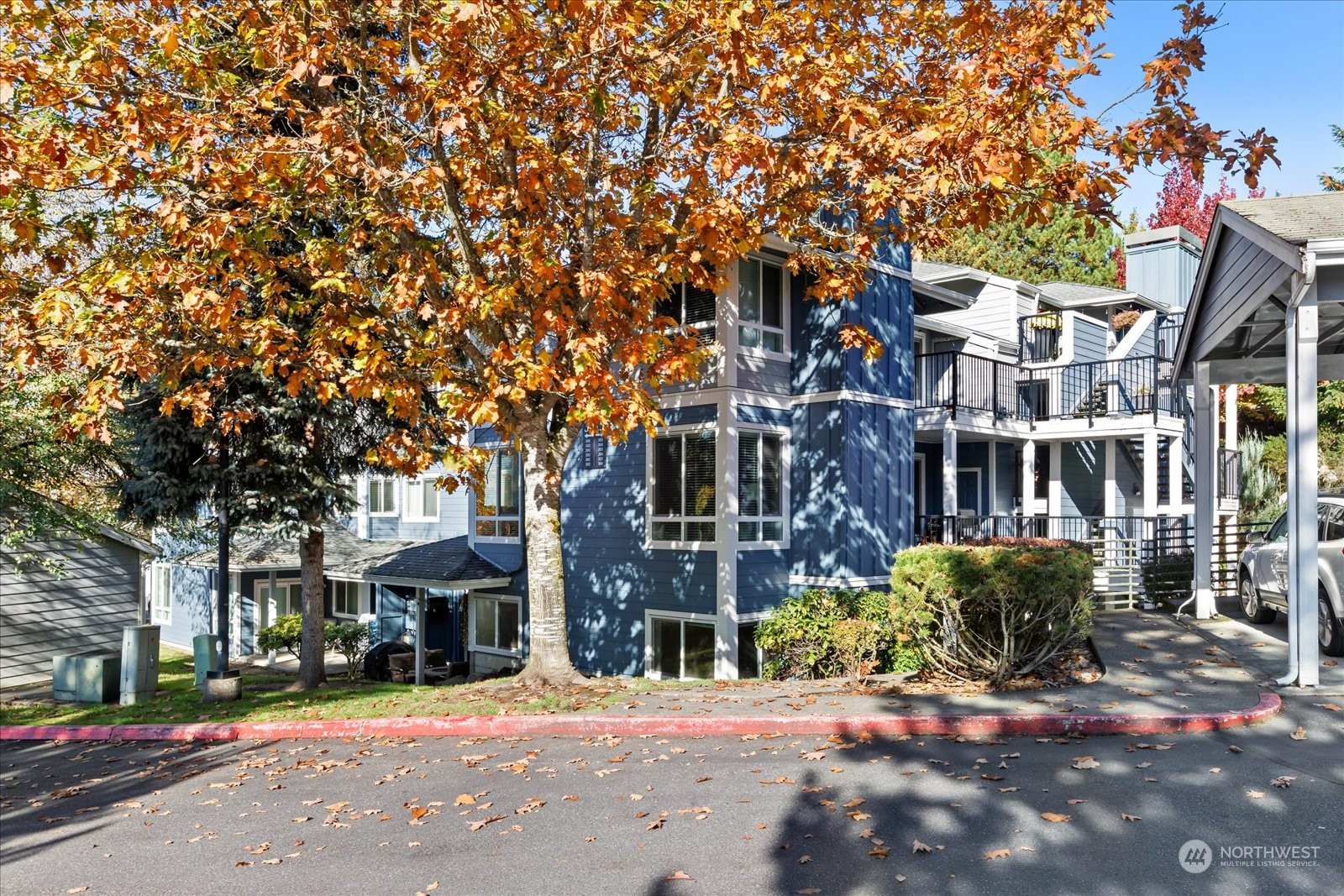 3915 243rd Place Southeast, Unit K103 Bothell, WA 98021 - Photo 1 of 36 a view of a building with a street