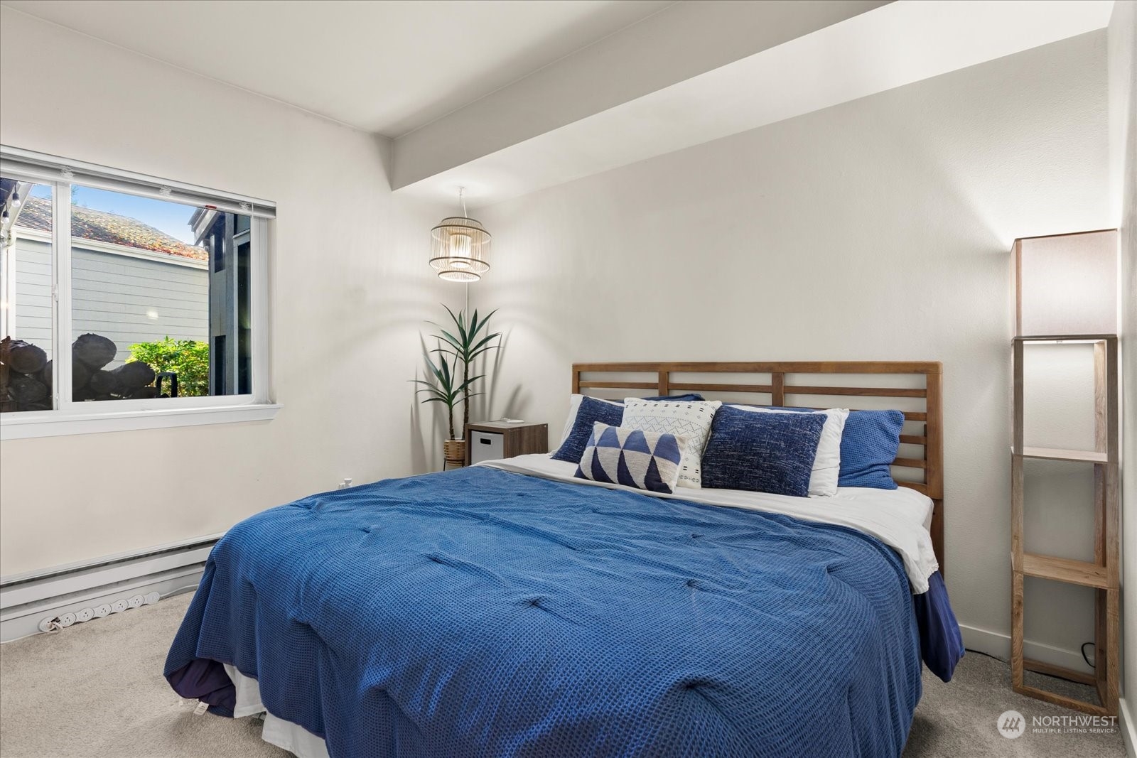 3915 243rd Place Southeast, Unit K103 Bothell, WA 98021 - Photo 12 of 36 a bedroom with a large bed and a window