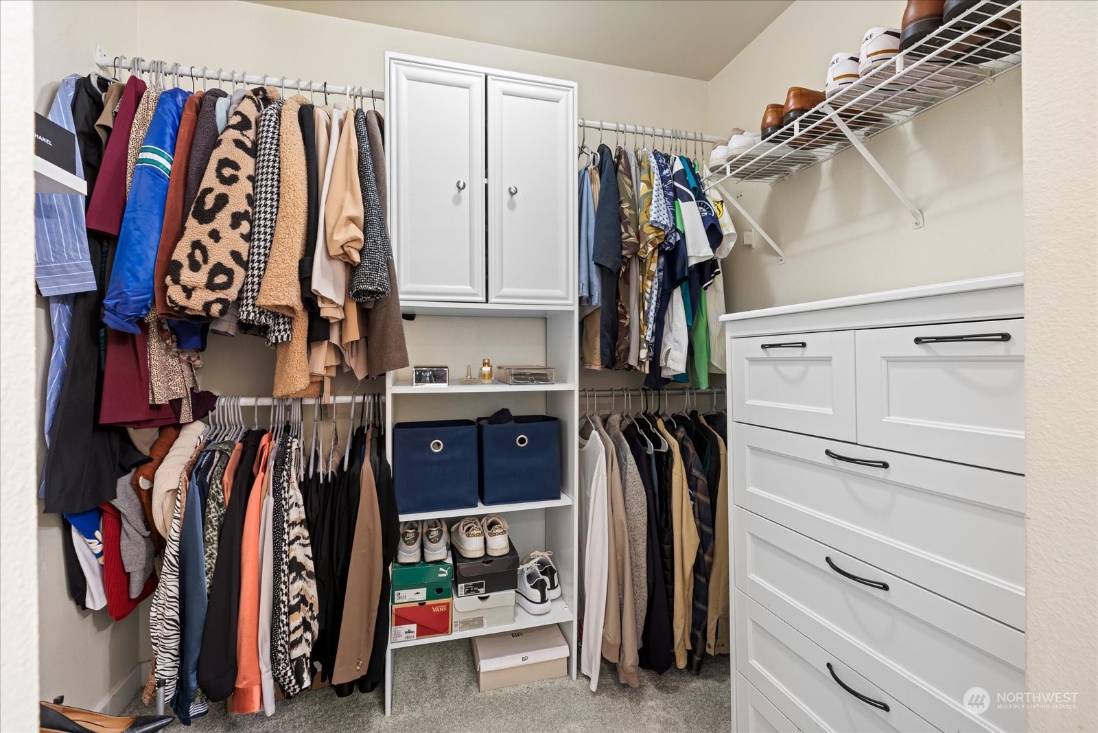 3915 243rd Place Southeast, Unit K103 Bothell, WA 98021 - Photo 16 of 36 a view of walk in closet with clothes and shoes