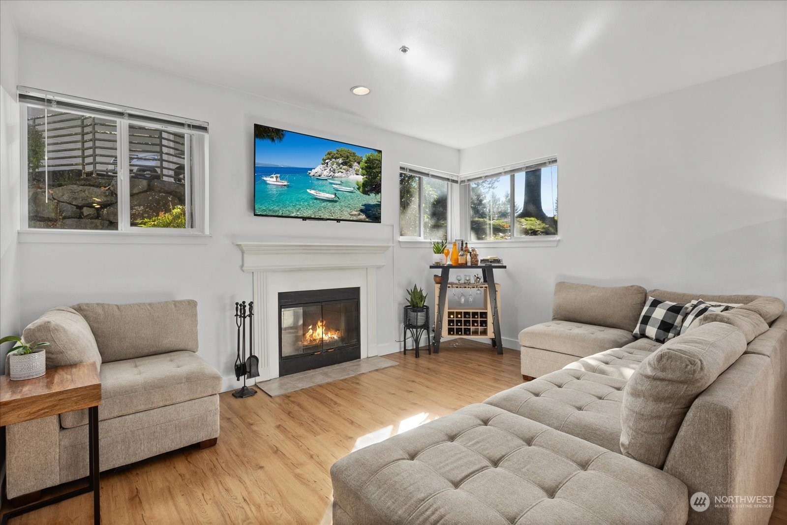 3915 243rd Place Southeast, Unit K103 Bothell, WA 98021 - Photo 3 of 36 a living room with furniture and a fireplace