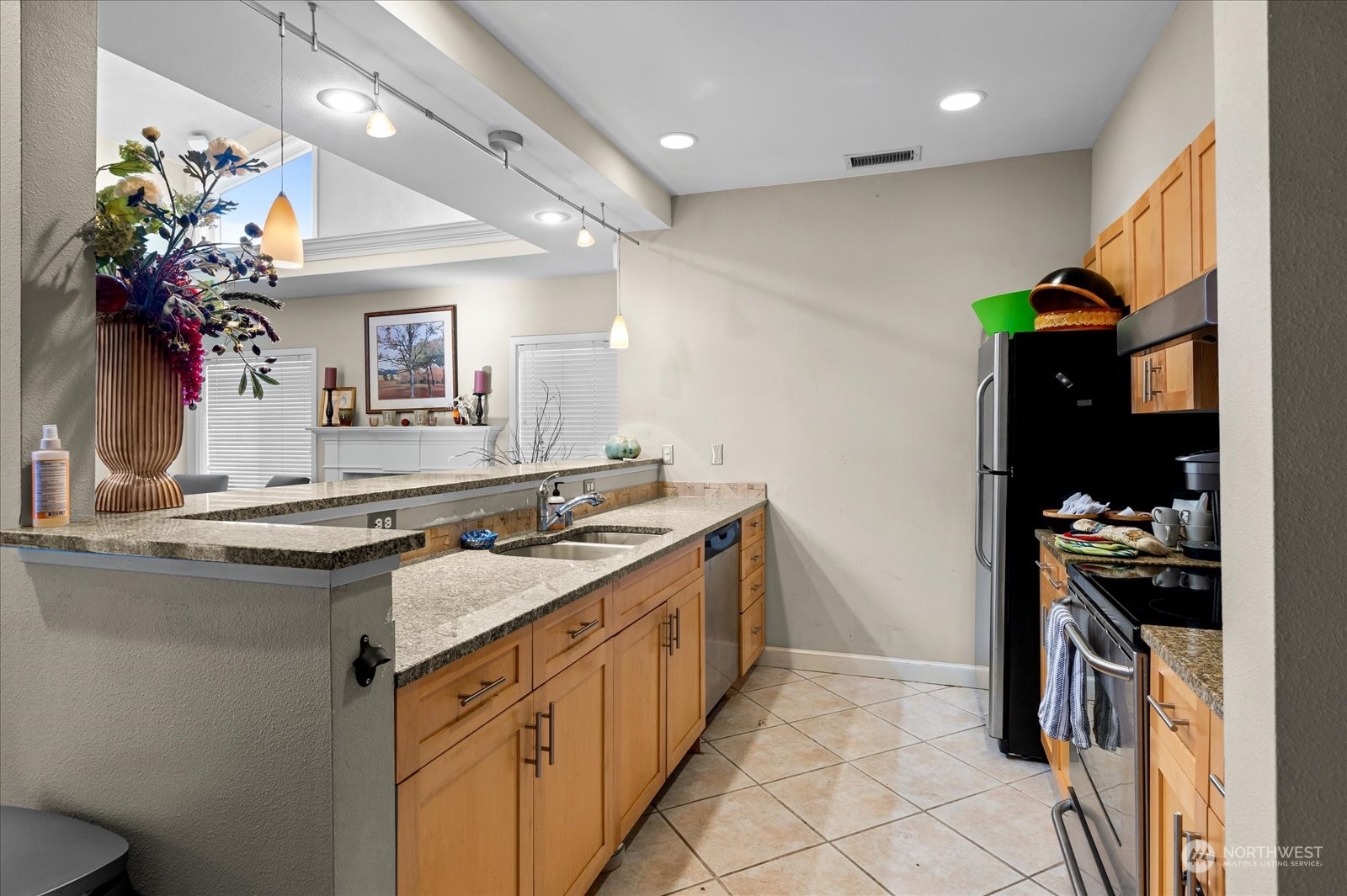 3915 243rd Place Southeast, Unit K103 Bothell, WA 98021 - Photo 31 of 36 a kitchen with a sink and stove top open