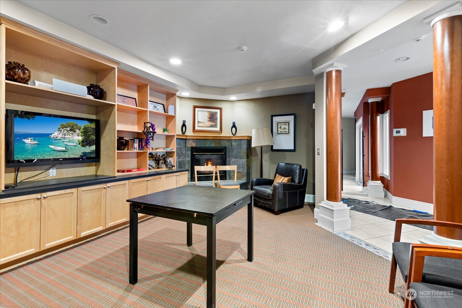 3915 243rd Place Southeast, Unit K103 Bothell, WA 98021 - Photo 34 of 36 a living room with furniture and a flat screen tv