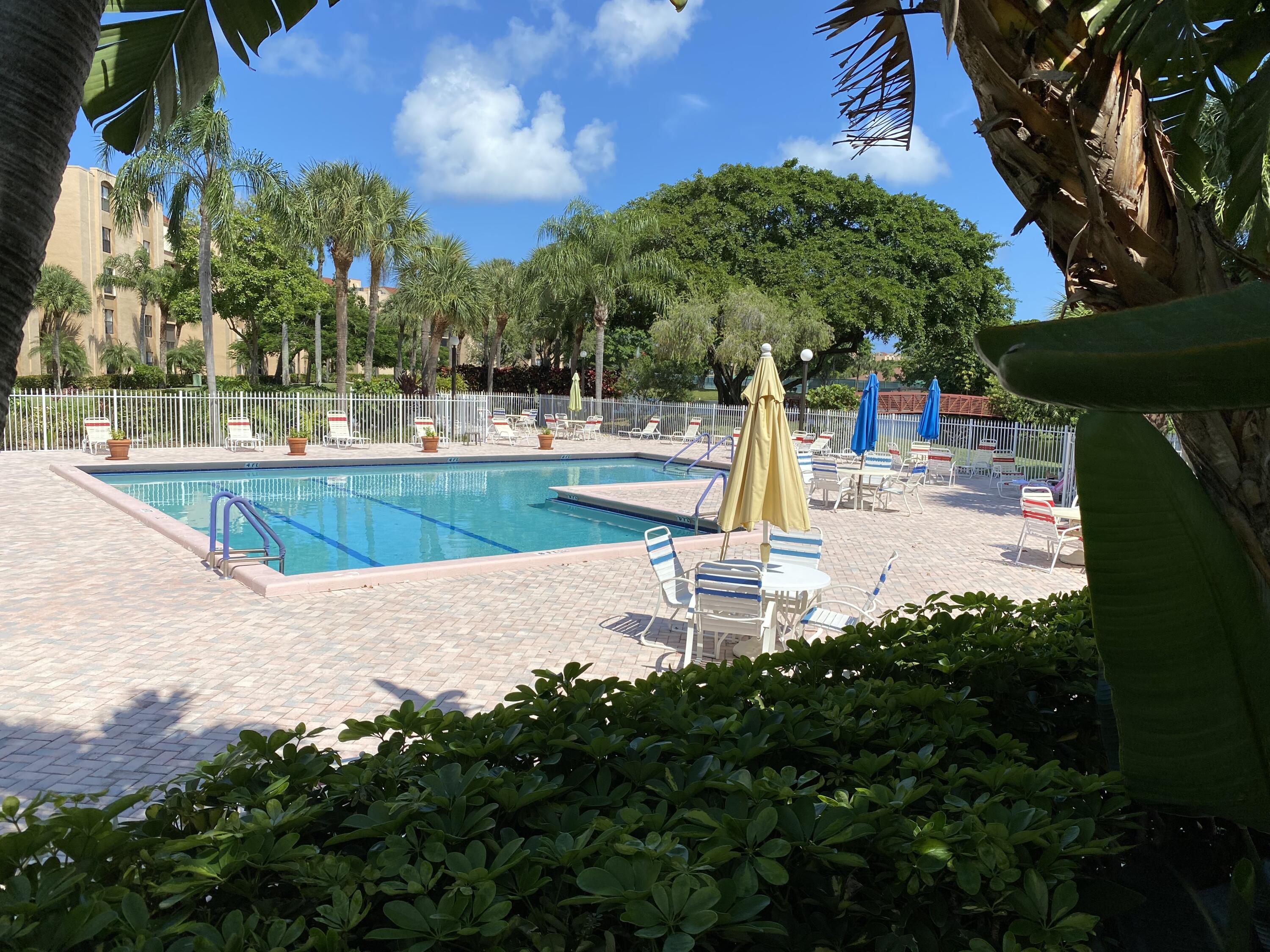 755 Dotterel Road, Unit 1108 Delray Beach, FL 33444 - Photo 26 of 28 a view of a swimming pool with a patio