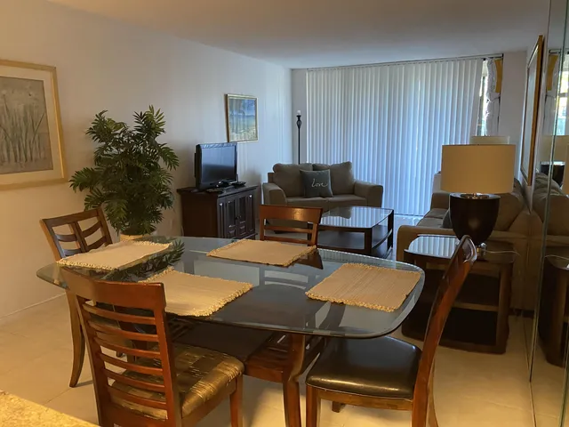 a view of a livingroom with furniture and a table