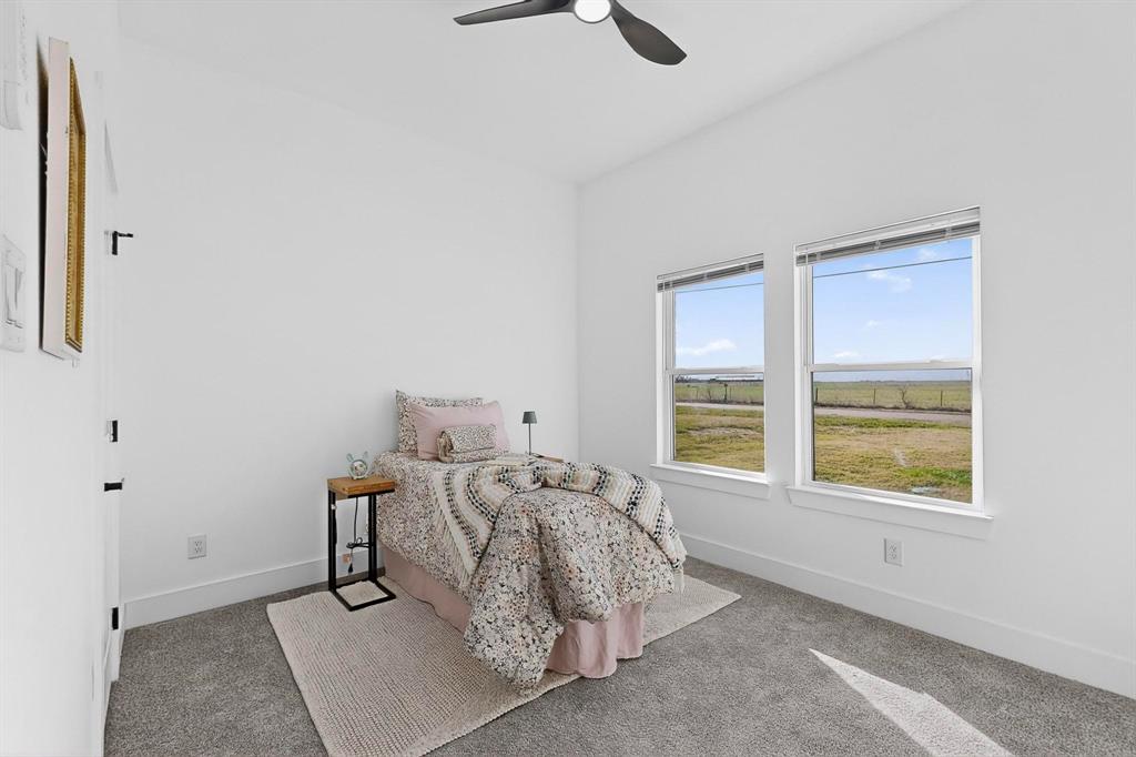 4464 Key Ranch Road Trinidad, TX 75163 - Photo 24 of 40 Carpeted bedroom featuring baseboards and a ceiling fan