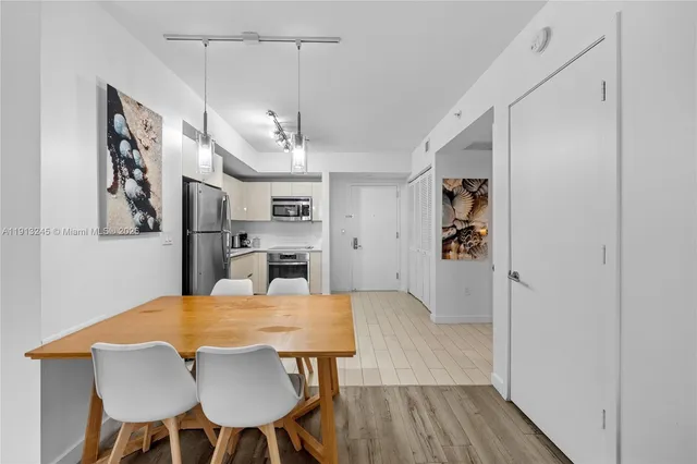 a view of living room filled with furniture and wooden floor