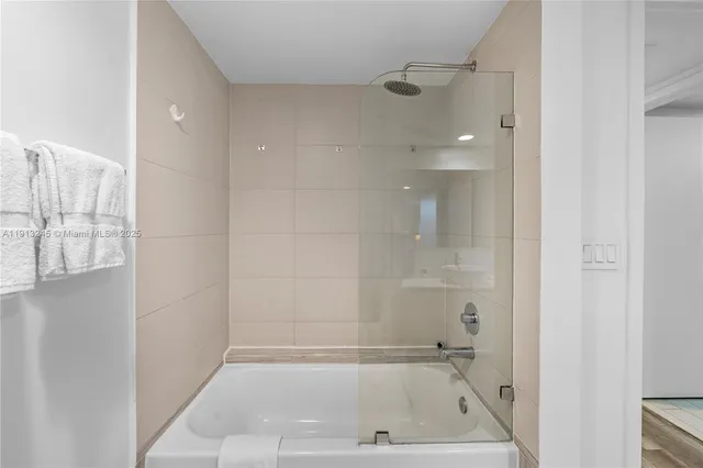 a bedroom with a bed and a table