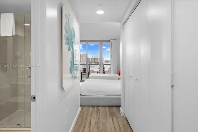 a bed room with a bed and a lamp