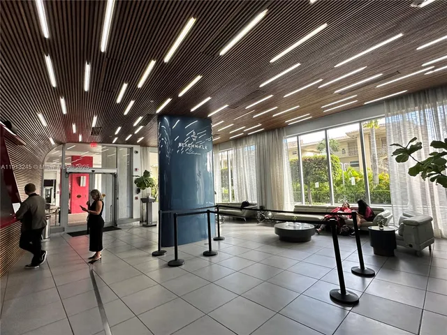 a kitchen with stainless steel appliances a refrigerator sink and microwave