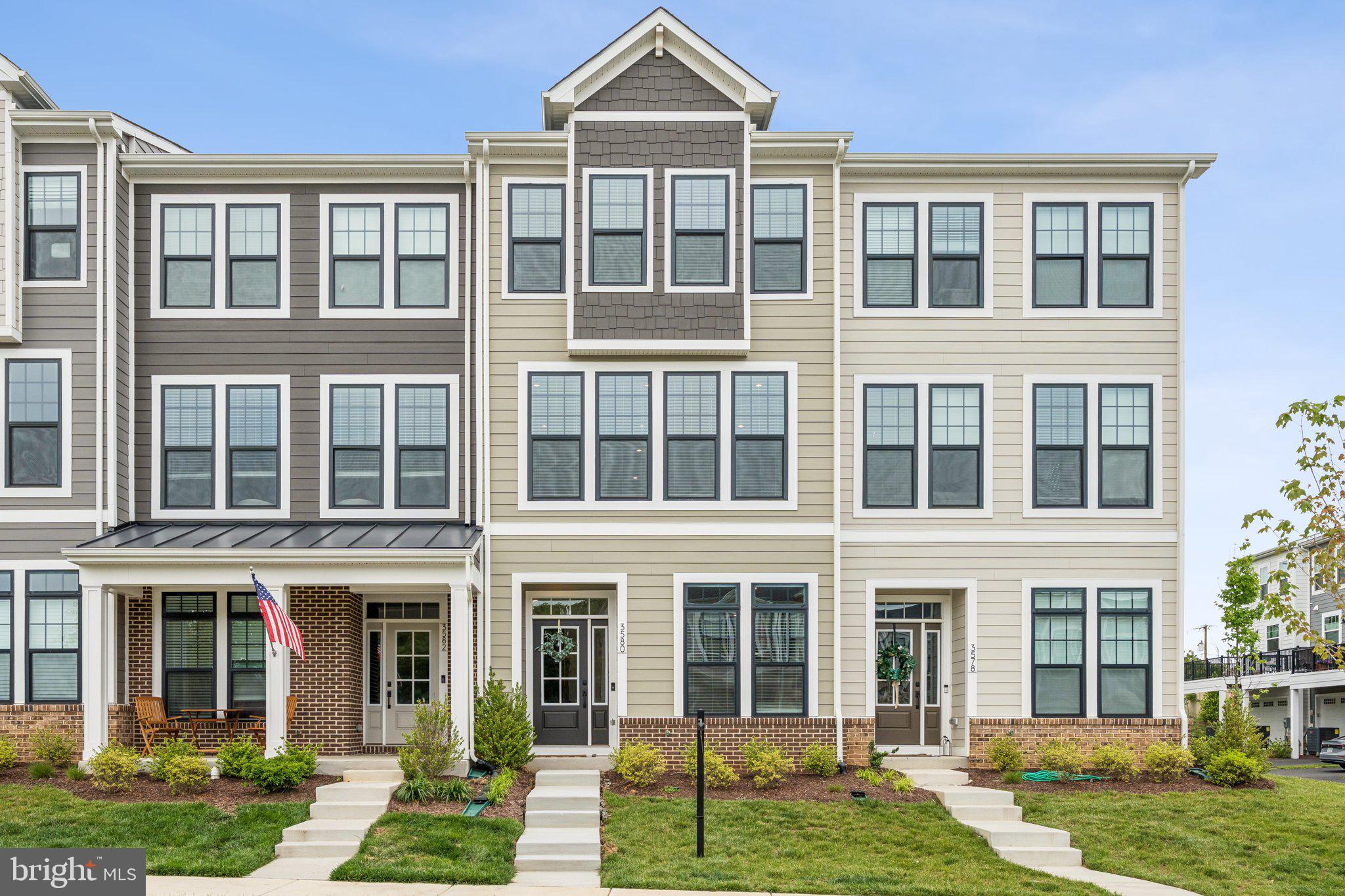 front view of a house with a yard