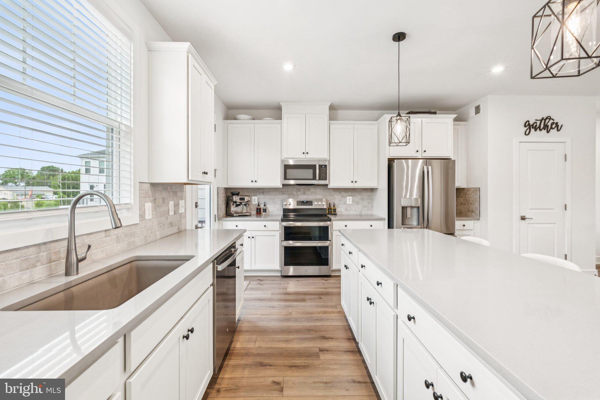 3580 Stephensons Hl Lane Marshall, VA 20115 - Photo 11 of 41 a large kitchen with stainless steel appliances kitchen island granite countertop a sink and a refrigerator