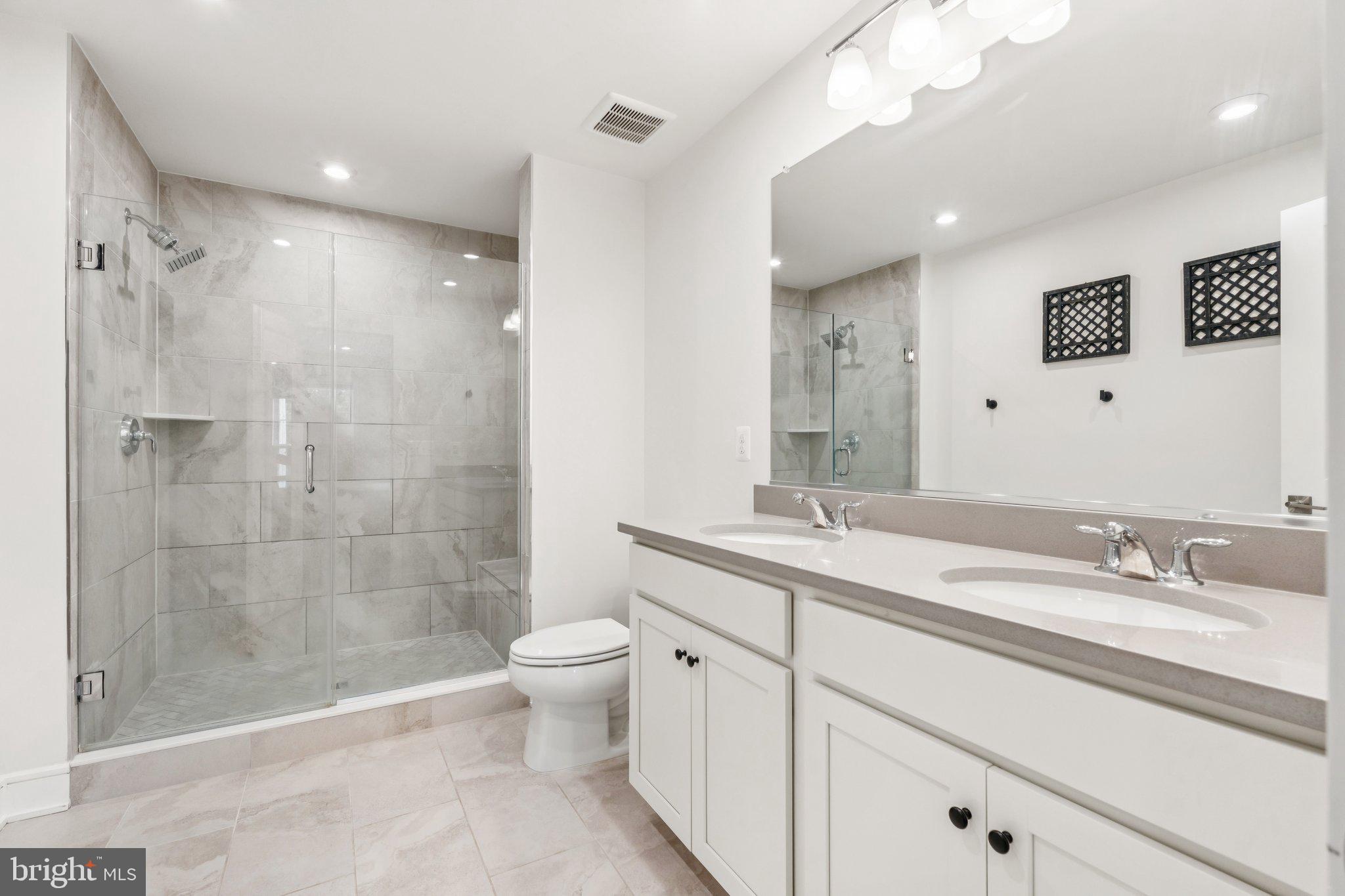 3580 Stephensons Hl Lane Marshall, VA 20115 - Photo 23 of 41 a bathroom with a double vanity sink toilet and shower