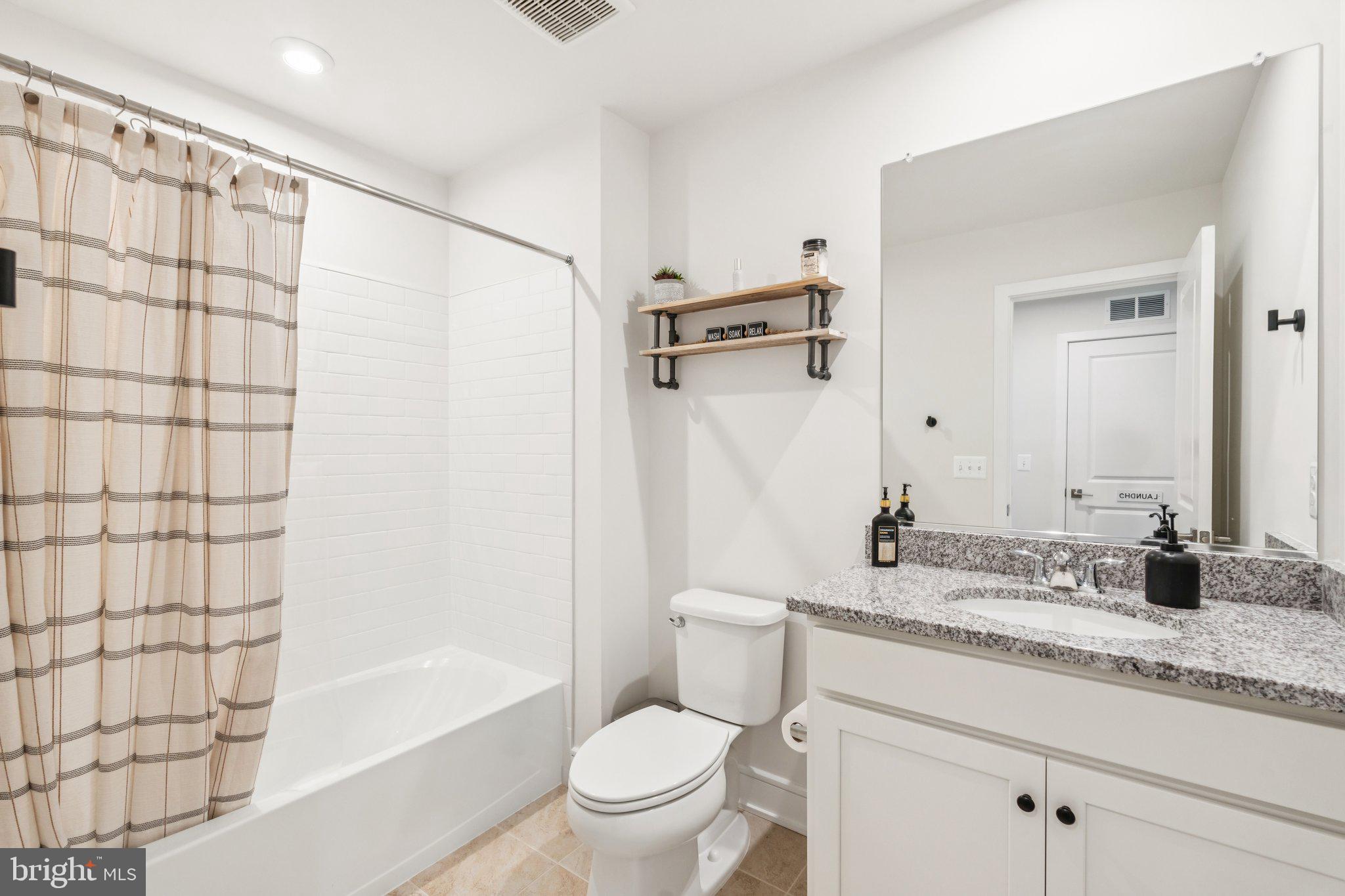 3580 Stephensons Hl Lane Marshall, VA 20115 - Photo 27 of 41 a bathroom with a granite countertop sink a toilet and shower