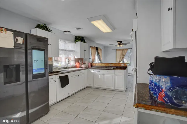 a kitchen with a sink cabinets and stainless steel appliances