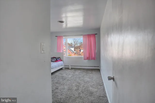 a bedroom with a bed and closet