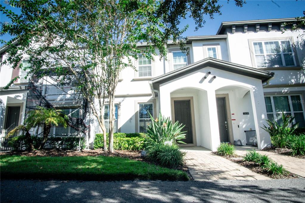 11636 Water Run Alley Windermere, FL 34786 - Photo 1 of 18 front view of a house with a garden