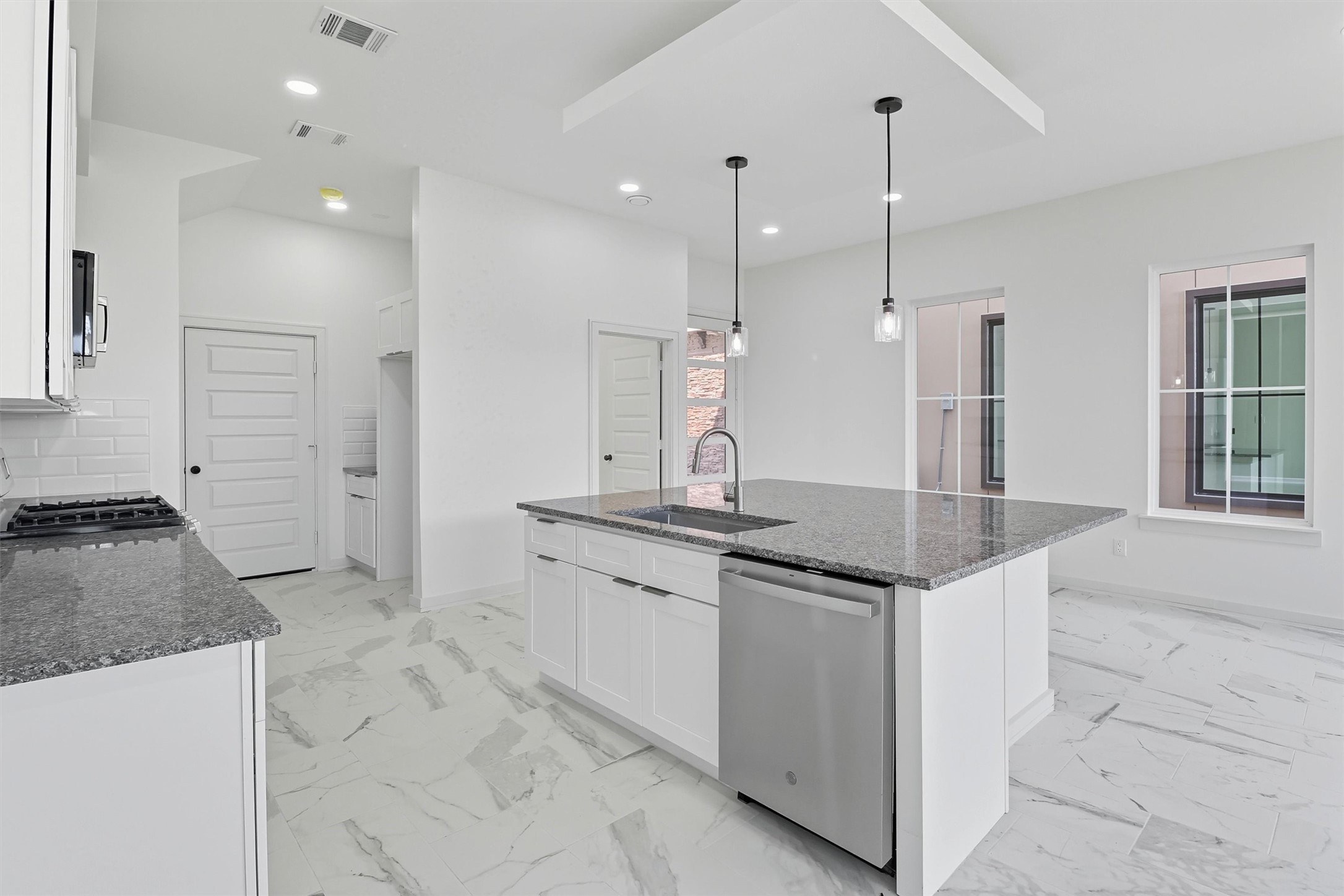 2927 El Fenice Lane Houston, TX 77057 - Photo 11 of 47 a kitchen with stainless steel appliances granite countertop a sink a stove and a refrigerator