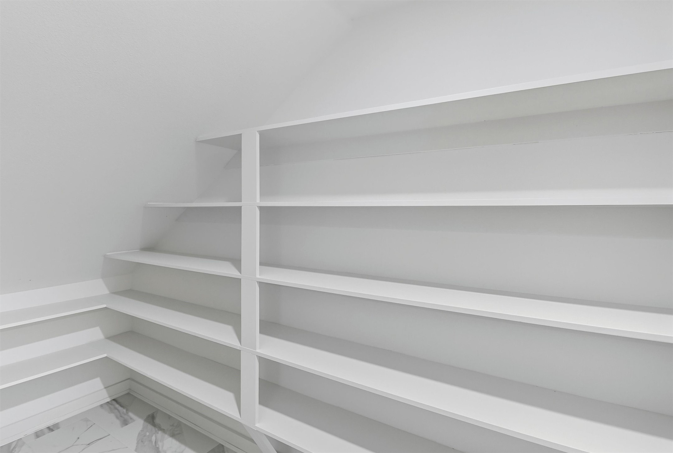 2927 El Fenice Lane Houston, TX 77057 - Photo 13 of 47 a view of walk in closet with empty racks