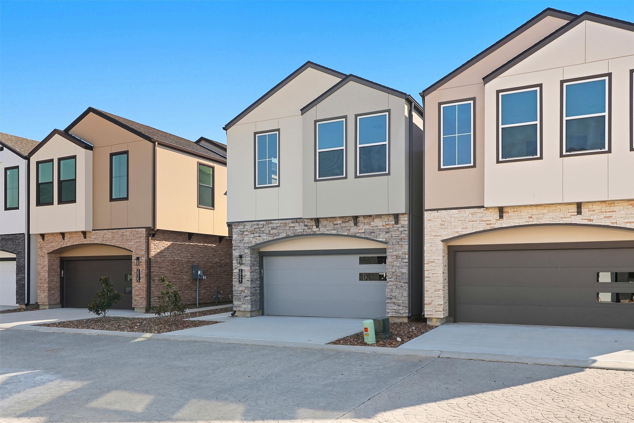 2927 El Fenice Lane Houston, TX 77057 - Photo 2 of 47 a front view of a house with a garage and a stove