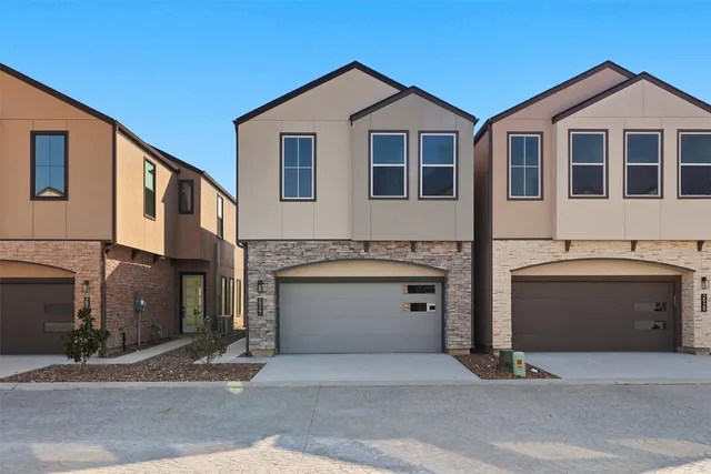 a front view of a house with a garage