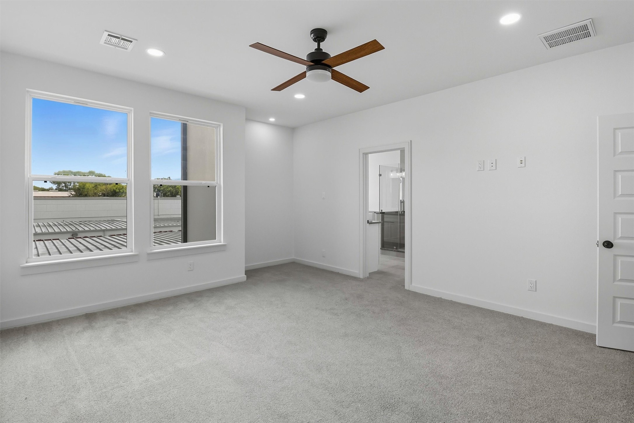 2927 El Fenice Lane Houston, TX 77057 - Photo 31 of 47 an empty room with windows and ceiling fan