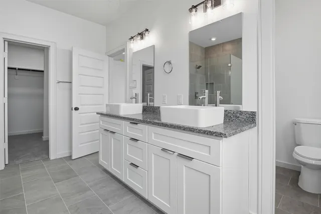 a view of a bathroom with closet and window
