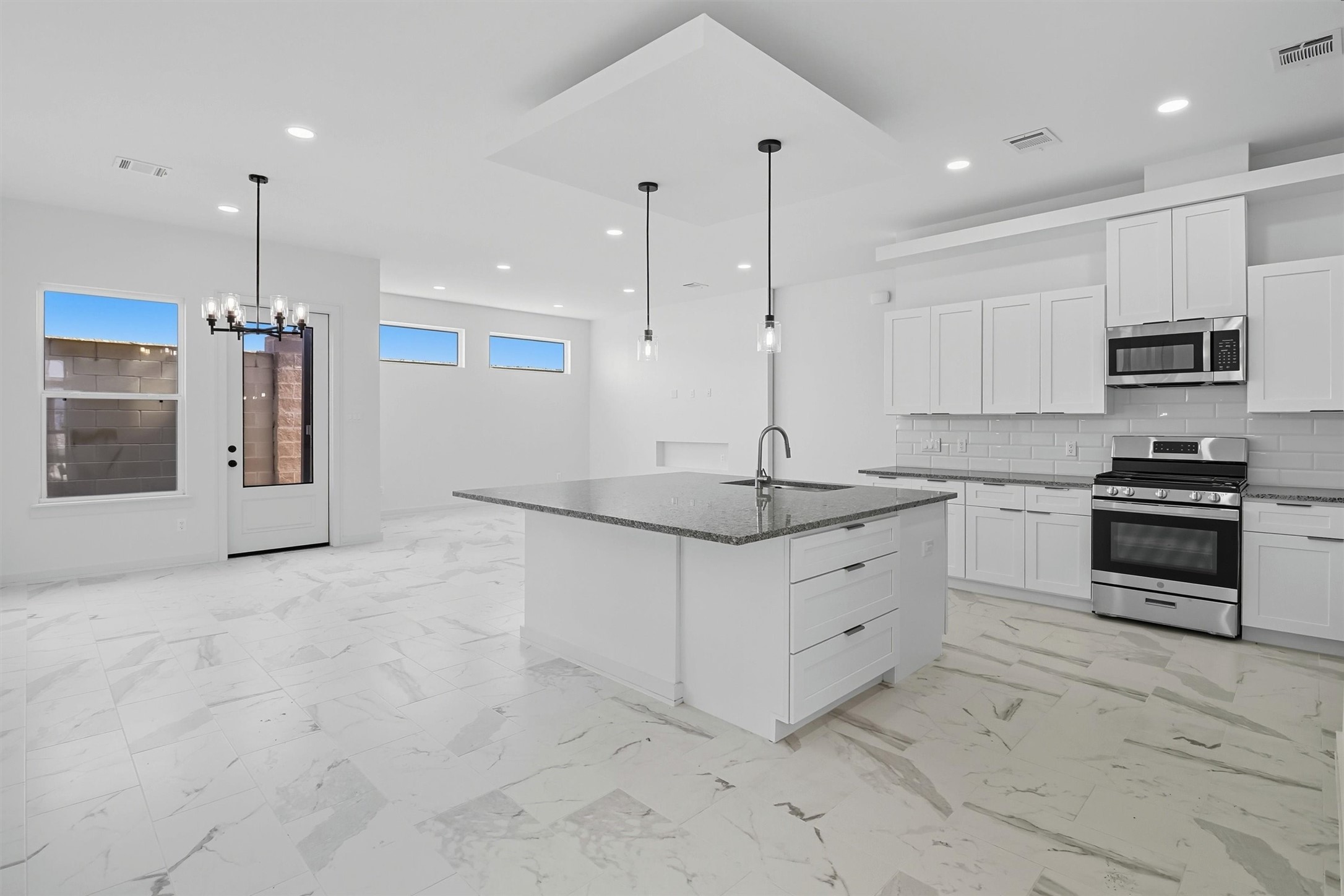 2927 El Fenice Lane Houston, TX 77057 - Photo 8 of 47 a kitchen with stainless steel appliances granite countertop a stove a sink and a refrigerator