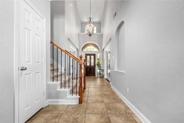 a view of a hallway with a flower pot