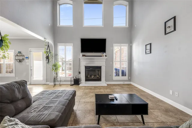 a living room with furniture fireplace and flat screen tv