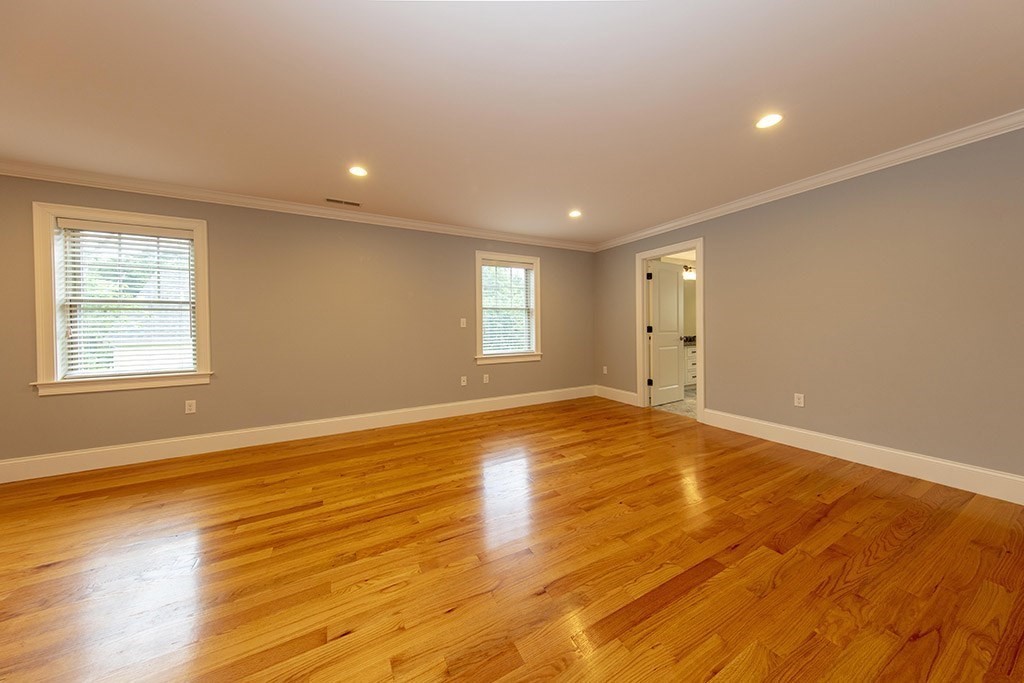 33 Liberty Avenue Lexington, MA 02420 - Photo 13 of 30 a view of empty room with wooden floor and fan