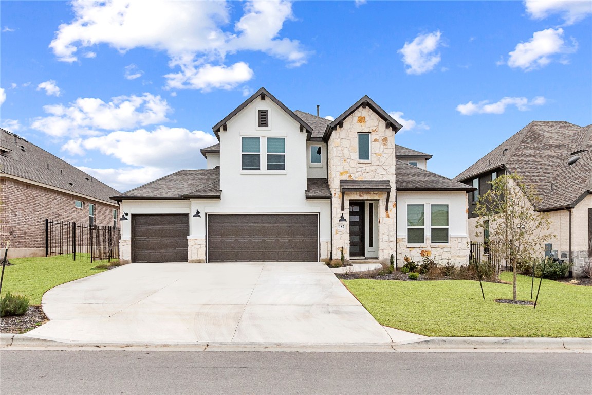 682 Two Creeks Lane Austin, TX 78737 - Photo 2 of 33 a view of house with yard and street view