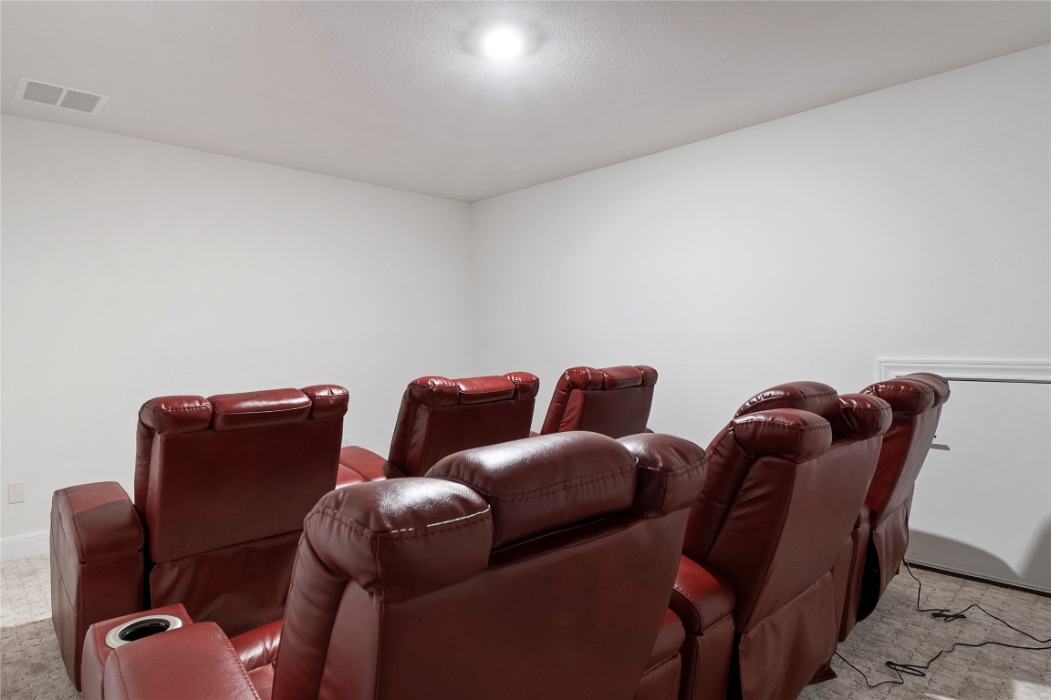 682 Two Creeks Lane Austin, TX 78737 - Photo 27 of 33 a couch sitting in a room next to a lamp