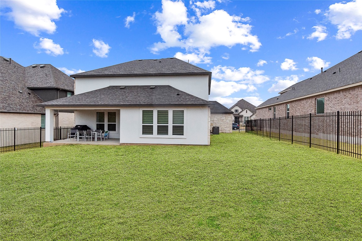 682 Two Creeks Lane Austin, TX 78737 - Photo 32 of 33 a house view with a garden space