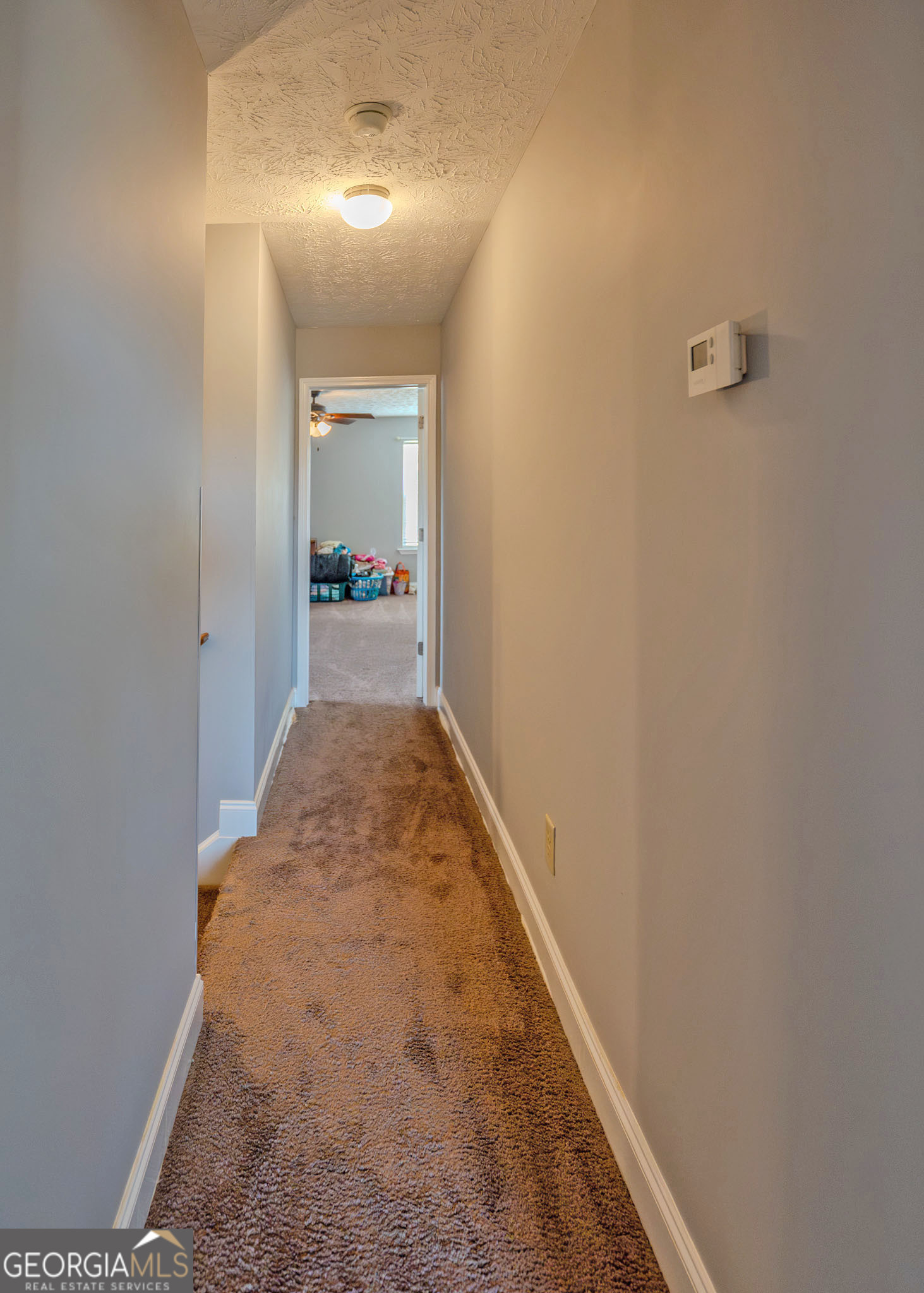 1363 McFarlin Bridge Road Carnesville, GA 30521 - Photo 24 of 78 a view of a hallway with wooden floor and a bathroom