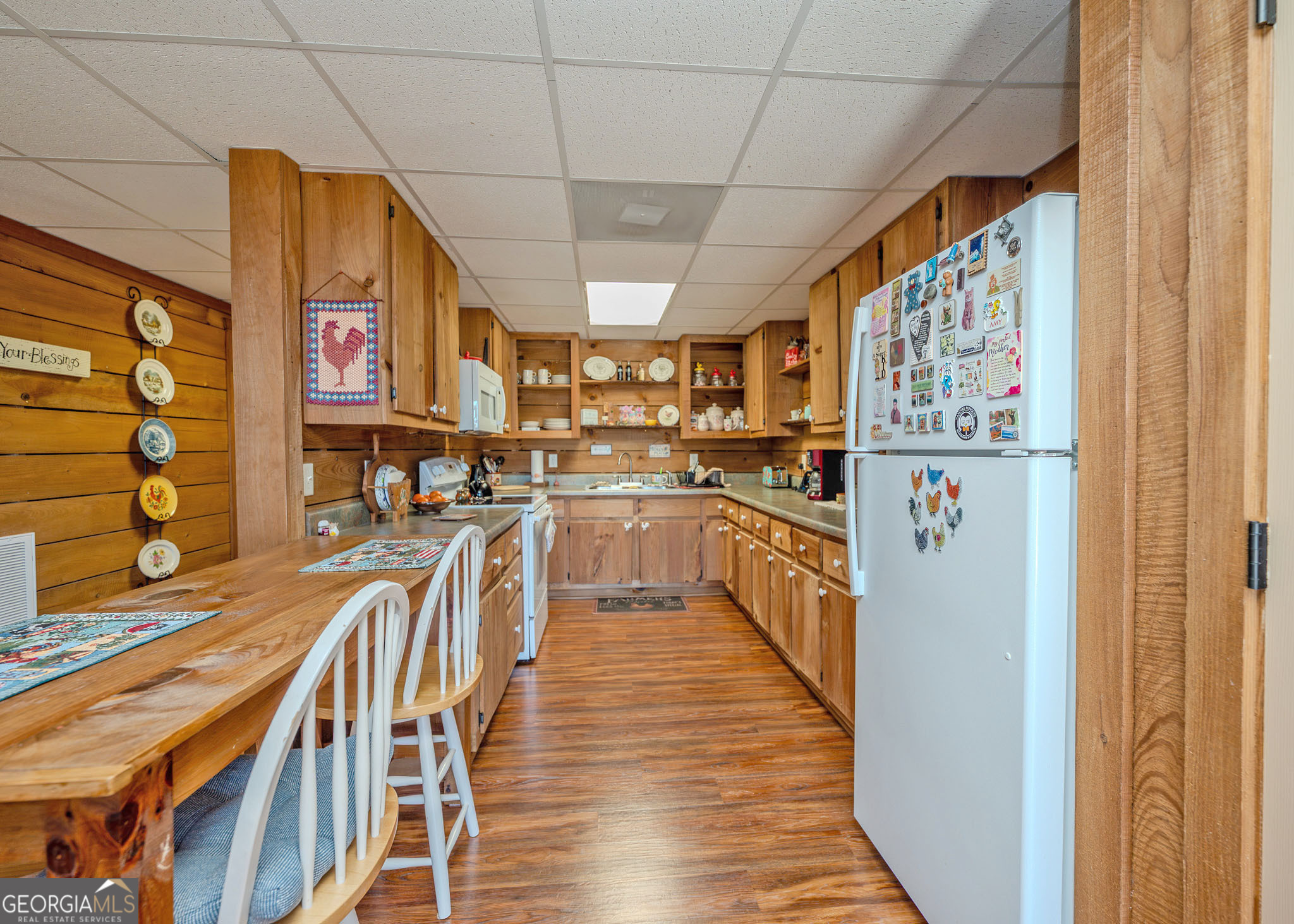 1363 McFarlin Bridge Road Carnesville, GA 30521 - Photo 32 of 78 a kitchen with stainless steel appliances granite countertop lots of counter top space and wooden floor