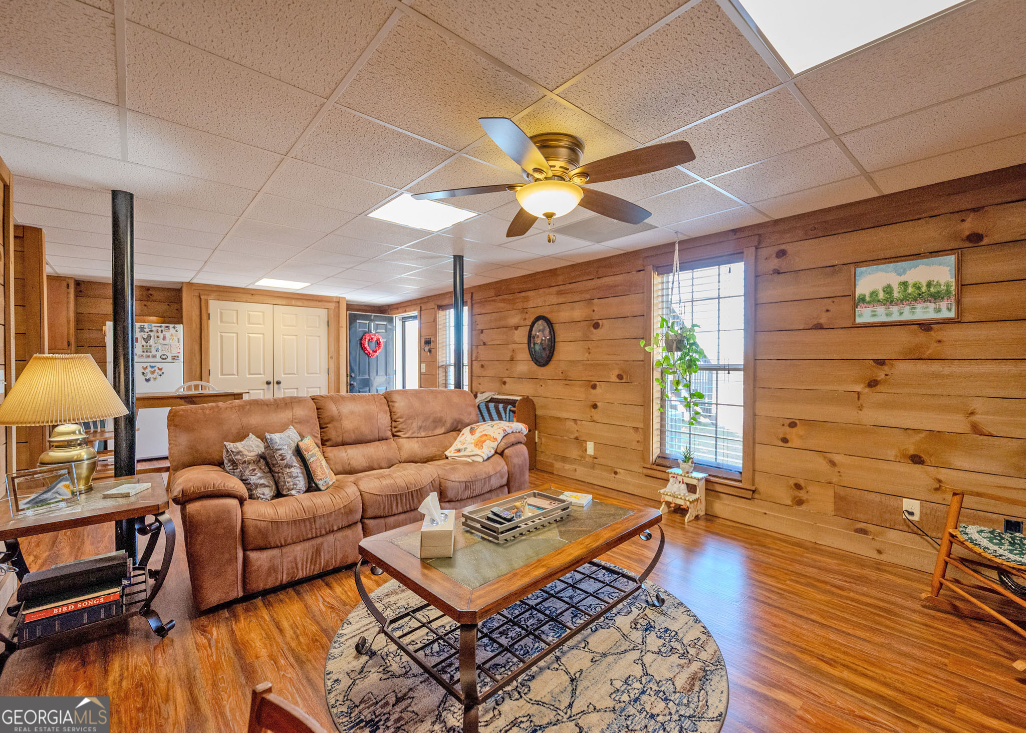 1363 McFarlin Bridge Road Carnesville, GA 30521 - Photo 33 of 78 a living room with patio furniture and a wooden floor