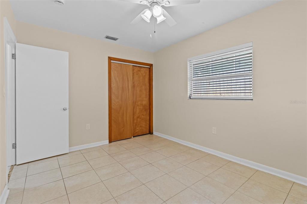 512 Richmond Street Dunedin, FL 34698 - Photo 17 of 37 a view of an empty room with a window