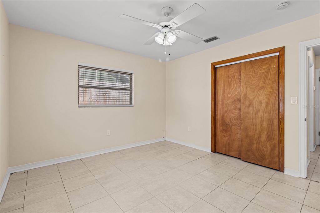 512 Richmond Street Dunedin, FL 34698 - Photo 19 of 37 an empty room with fan and windows