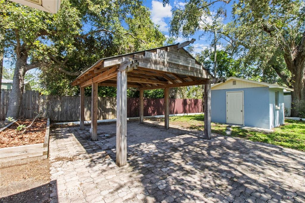 512 Richmond Street Dunedin, FL 34698 - Photo 23 of 37 a view of a house with backyard and sitting area