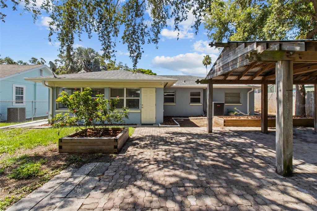 512 Richmond Street Dunedin, FL 34698 - Photo 25 of 37 a house view with a garden space