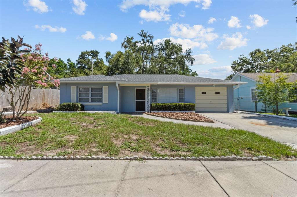512 Richmond Street Dunedin, FL 34698 - Photo 26 of 37 front view of a house with a yard
