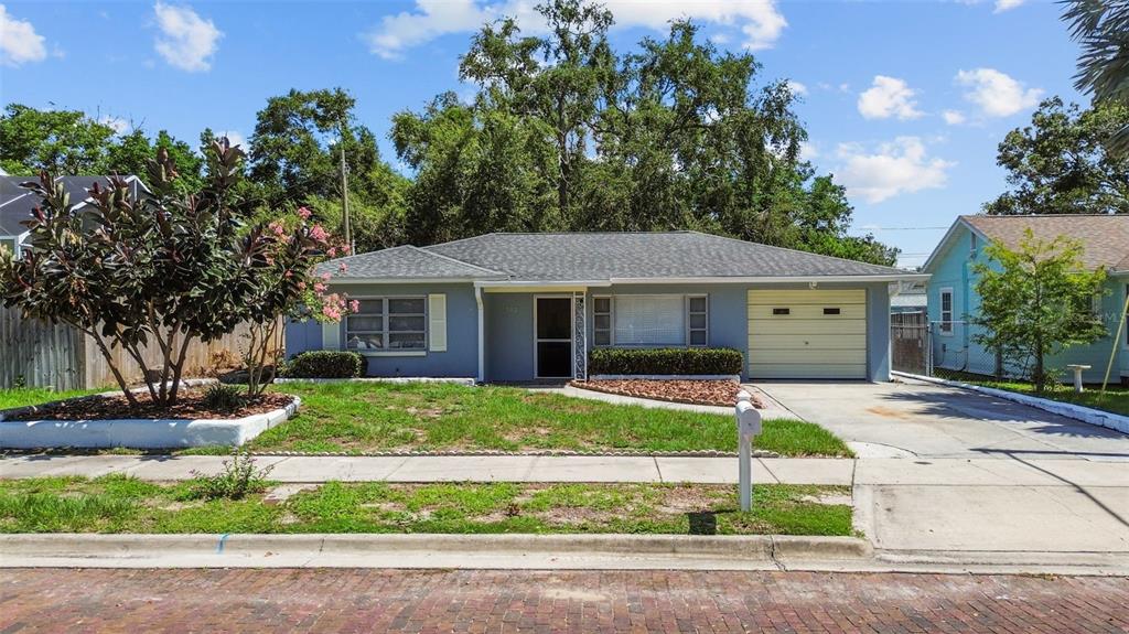 512 Richmond Street Dunedin, FL 34698 - Photo 28 of 37 front view of a house with a yard