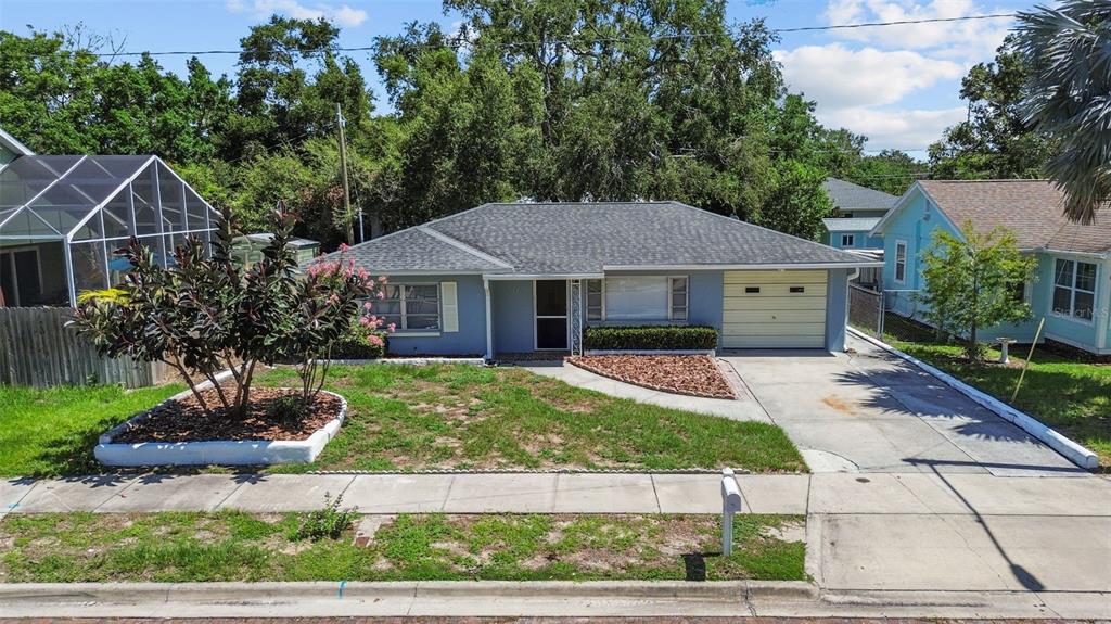 512 Richmond Street Dunedin, FL 34698 - Photo 30 of 37 a front view of a house with a yard