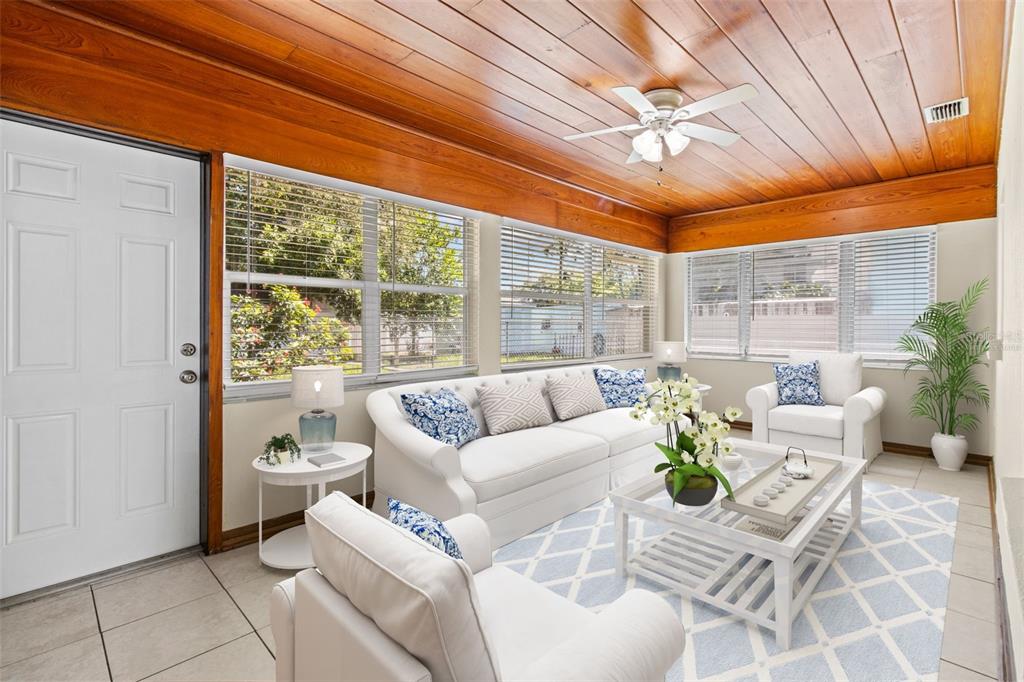 512 Richmond Street Dunedin, FL 34698 - Photo 10 of 37 a living room with furniture and a large window